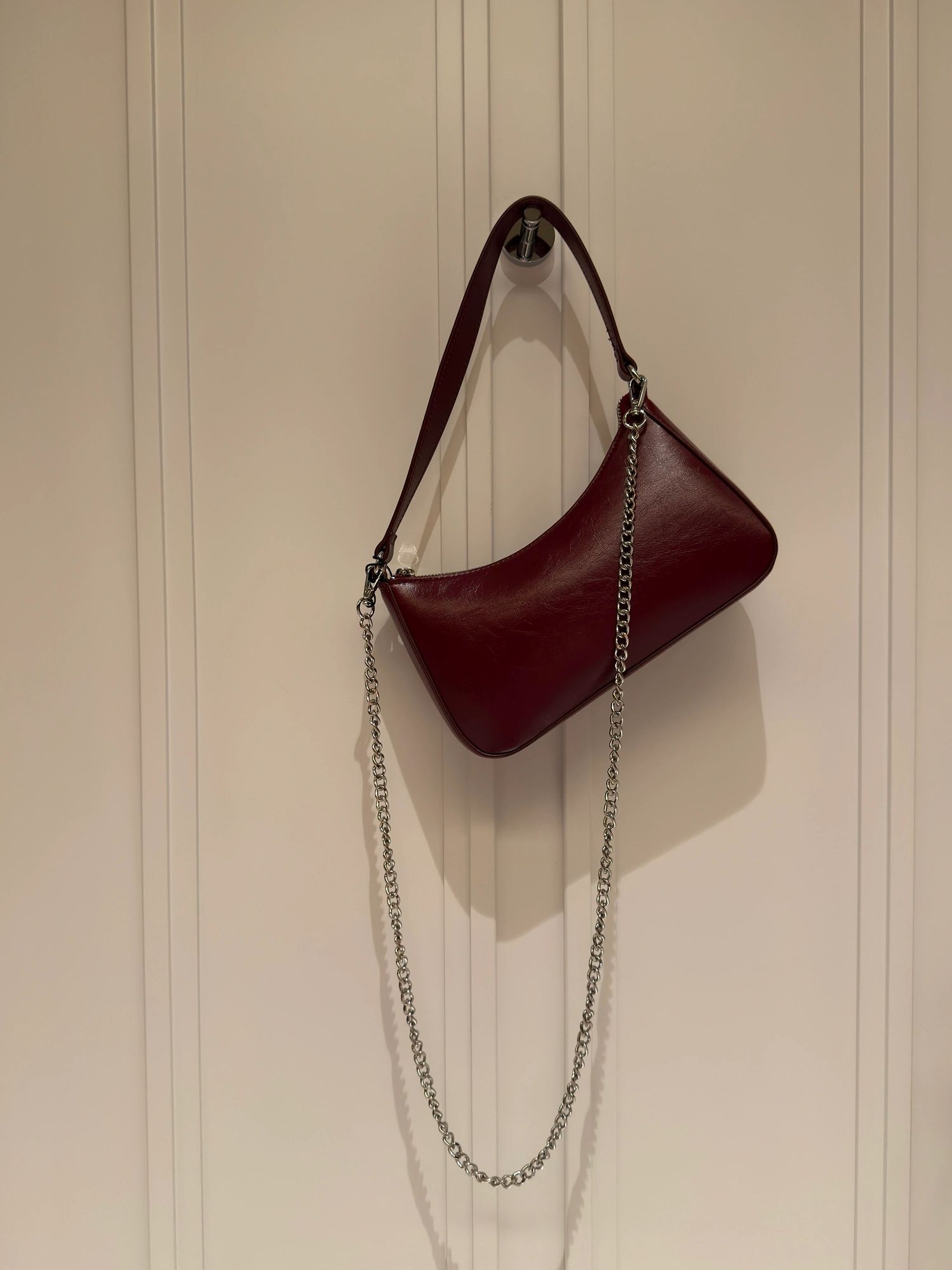 Maroon leather handbag with chain strap